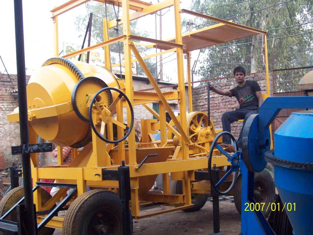 Mobile Self-Loading Concrete Mixer Machine - Yellow